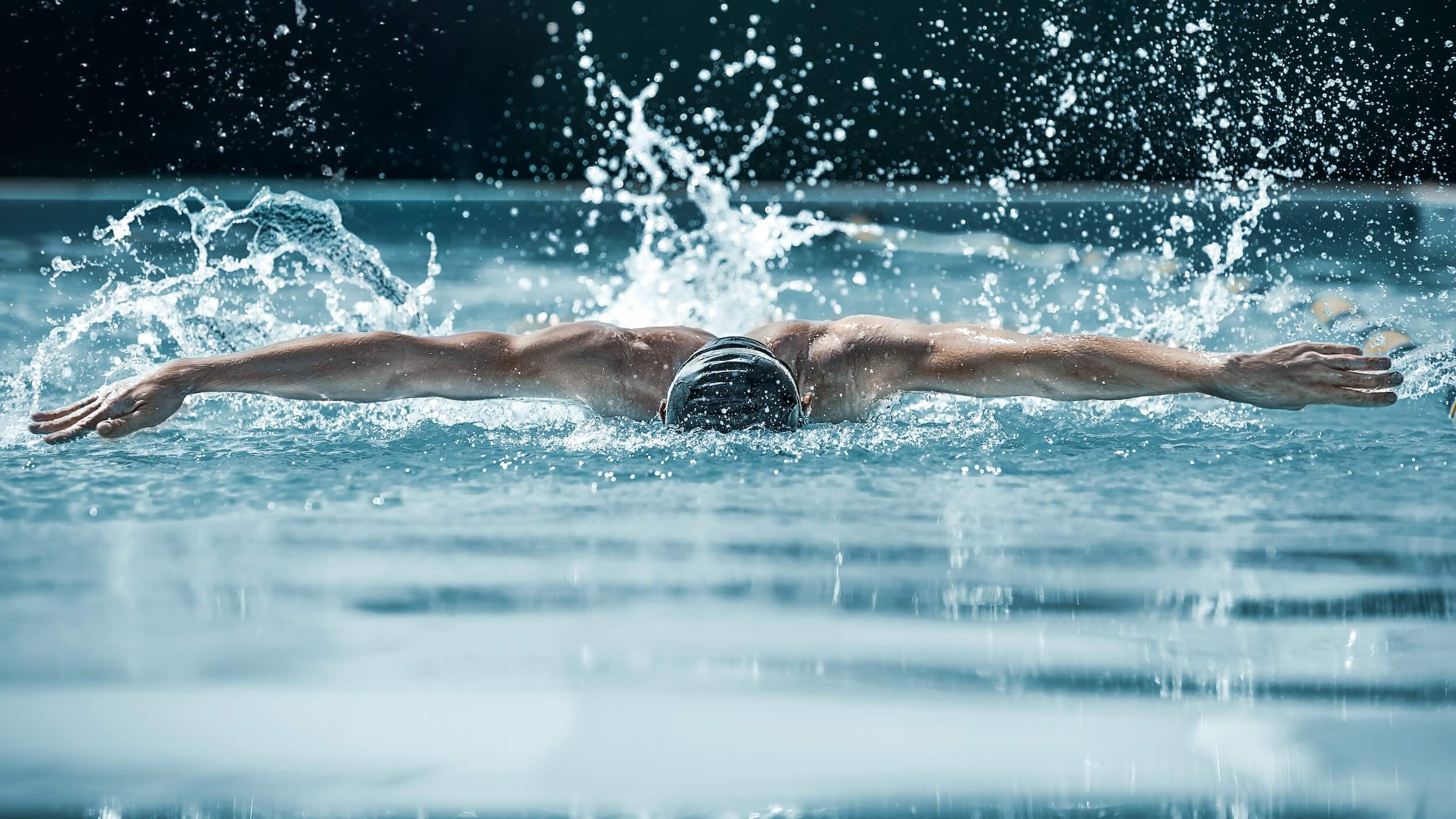 Taking a breath. Swimmer in a pool.